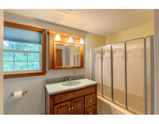34 Brox Road Dracut, MA 01826 - Photo 21 of 35 a bathroom with a sink mirror and a shower