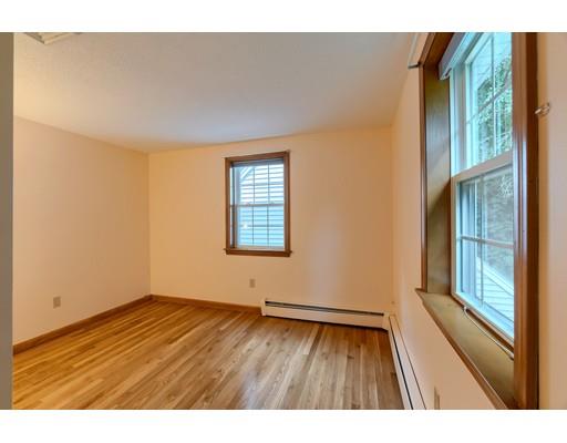34 Brox Road Dracut, MA 01826 - Photo 23 of 35 a view of an empty room with wooden floor and a window