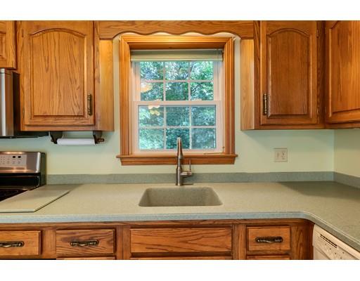 34 Brox Road Dracut, MA 01826 - Photo 4 of 35 a kitchen with stainless steel appliances granite countertop a sink and a window
