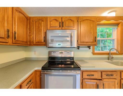 34 Brox Road Dracut, MA 01826 - Photo 5 of 35 a kitchen with a stove and a microwave