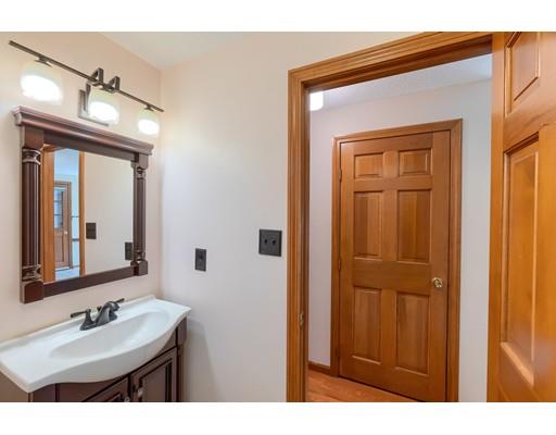 34 Brox Road Dracut, MA 01826 - Photo 6 of 35 a bathroom with a sink and a mirror