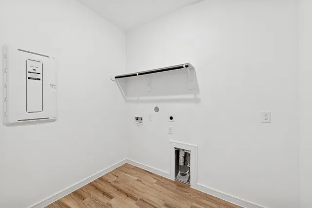 a living room with furniture and a mirror