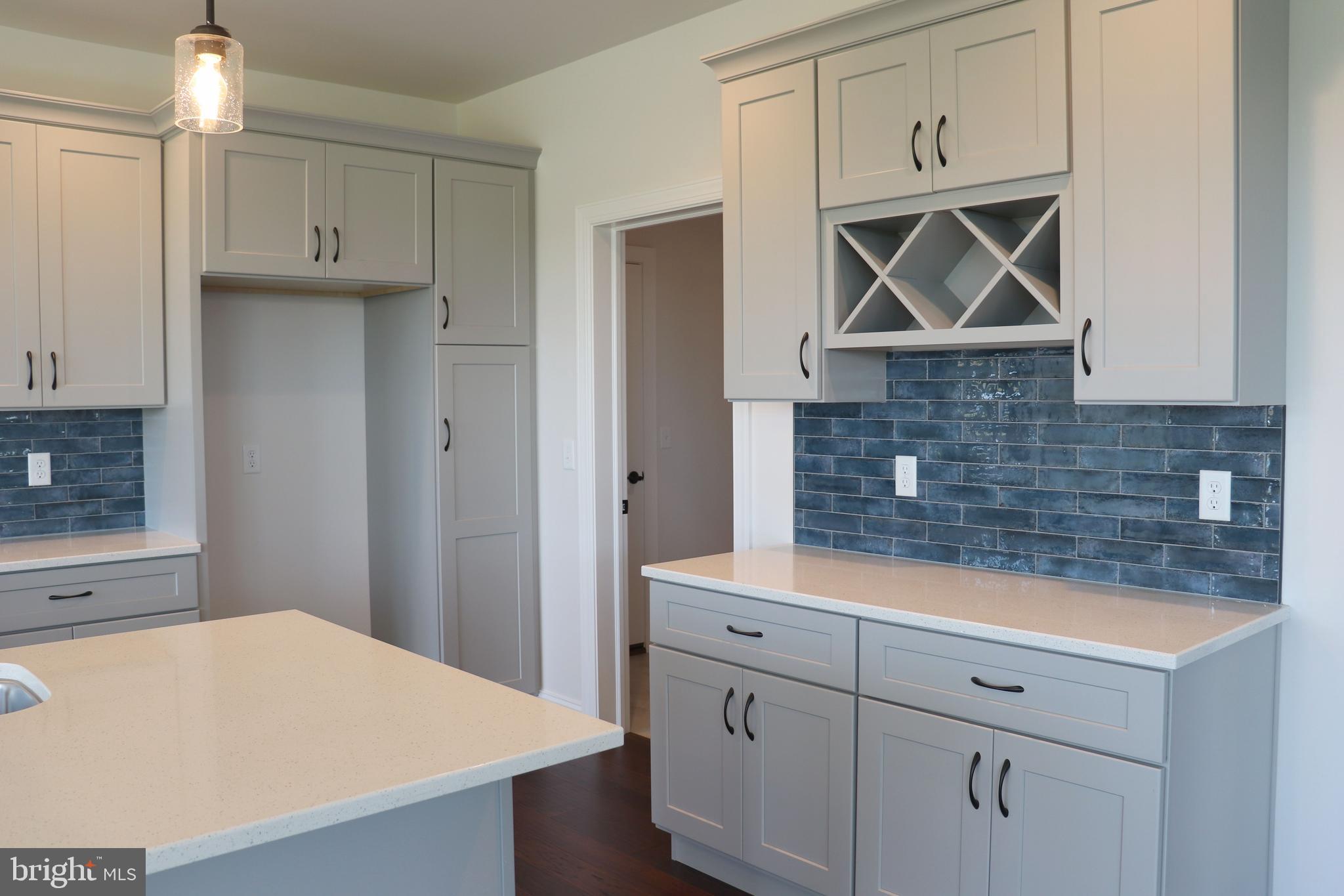1029 Strafford Place, Unit 55 Lancaster, PA 17601 - Photo 11 of 40 a kitchen with white cabinets and white appliances