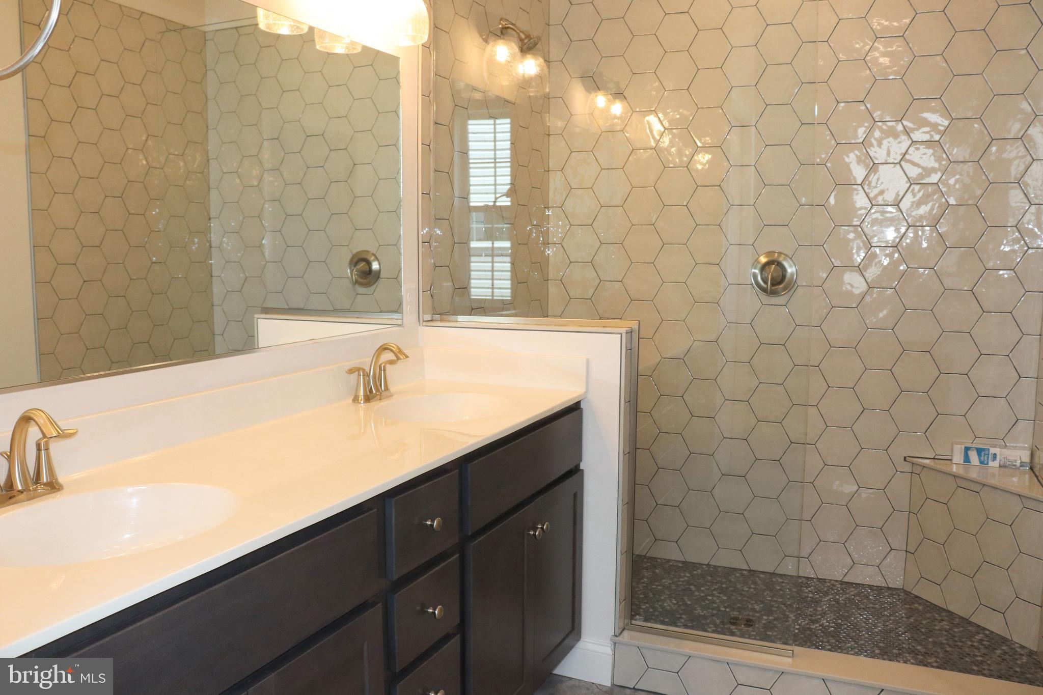 1029 Strafford Place, Unit 55 Lancaster, PA 17601 - Photo 21 of 40 a bathroom with a sink a toilet and shower