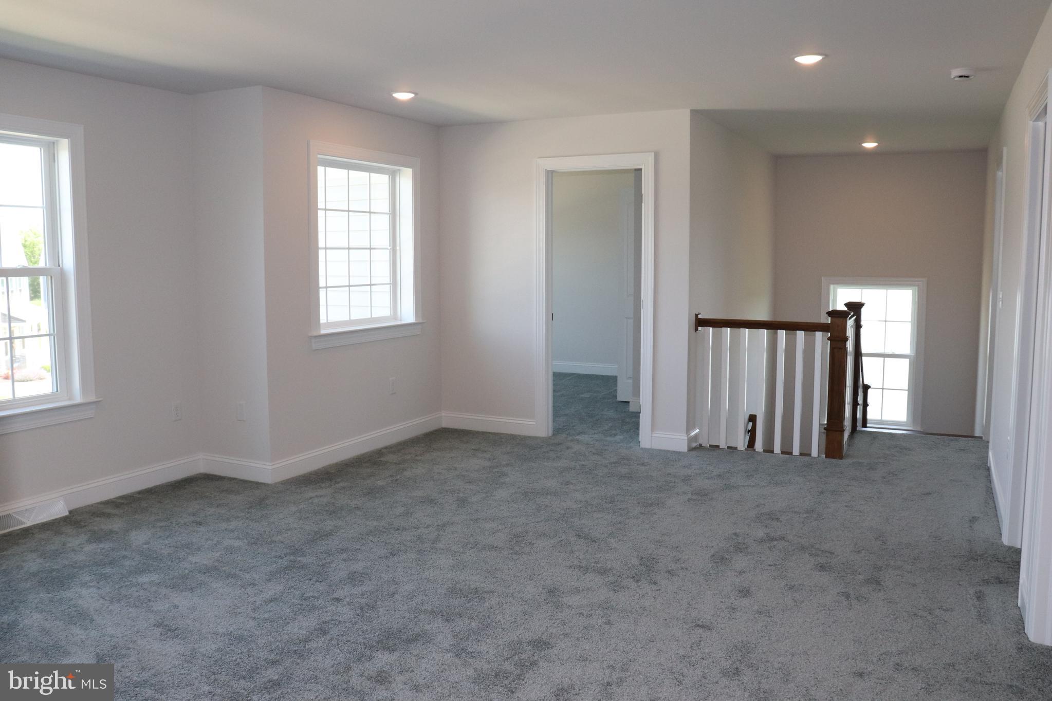 1029 Strafford Place, Unit 55 Lancaster, PA 17601 - Photo 27 of 40 an empty room with windows