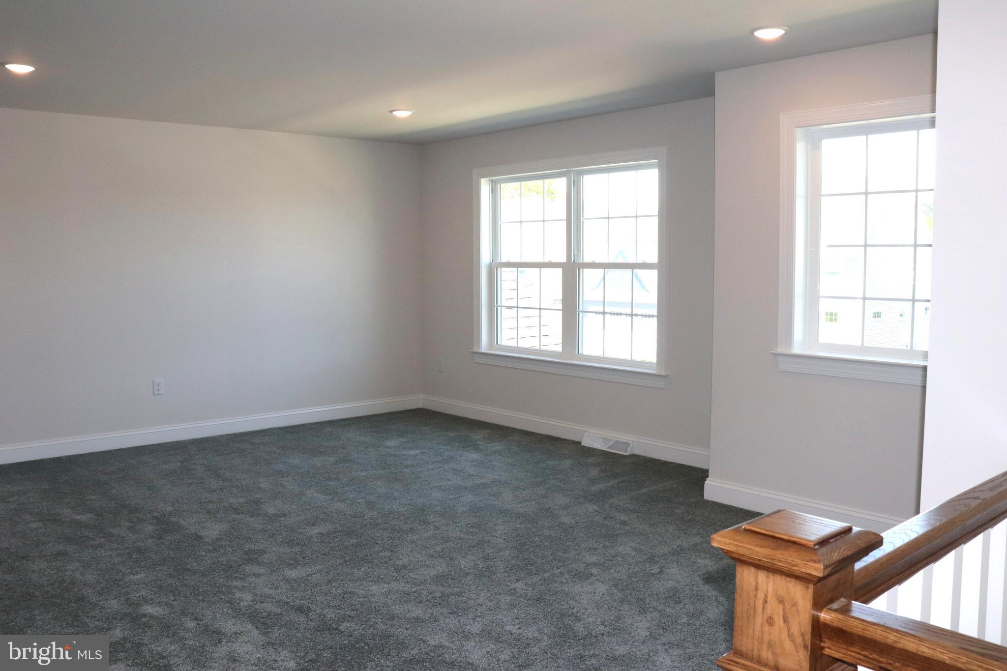 1029 Strafford Place, Unit 55 Lancaster, PA 17601 - Photo 28 of 40 an empty room with windows