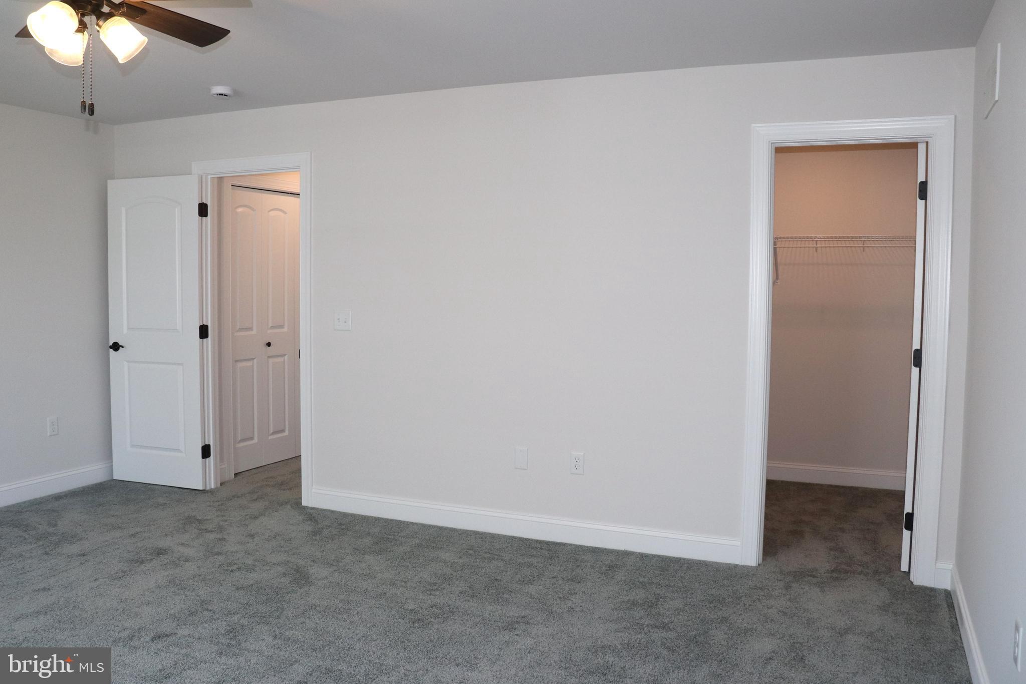 1029 Strafford Place, Unit 55 Lancaster, PA 17601 - Photo 36 of 40 an empty room with a ceiling fan
