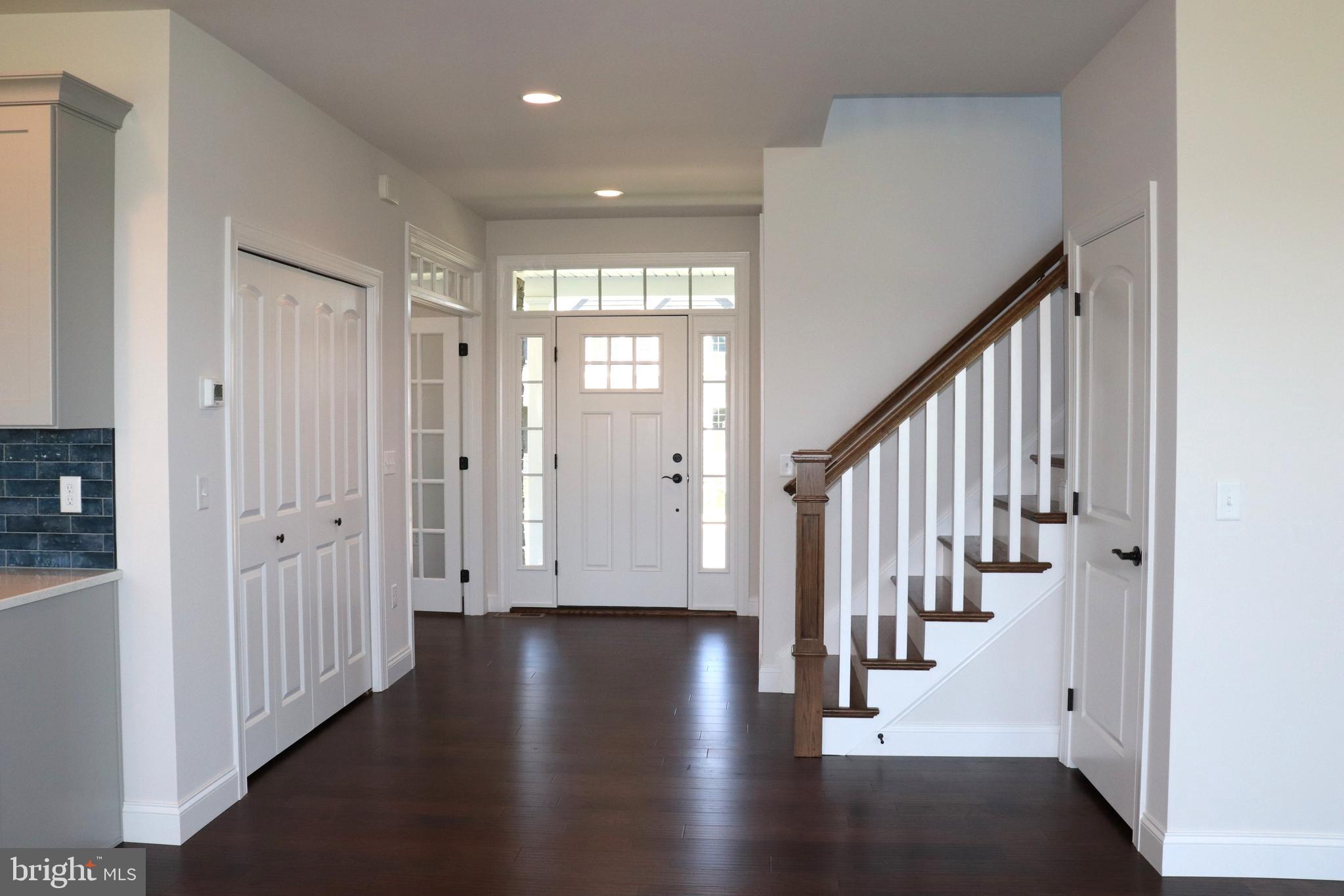 1029 Strafford Place, Unit 55 Lancaster, PA 17601 - Photo 4 of 40 a view of entryway with wooden floor and stairs
