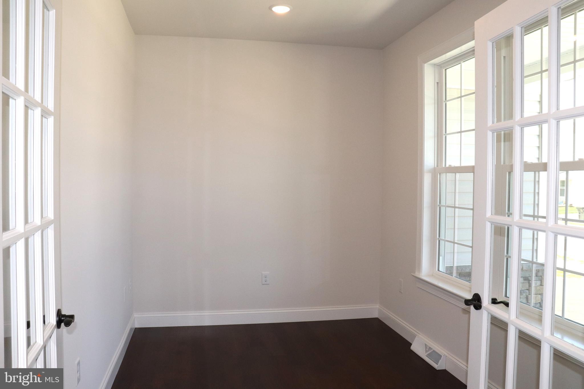 1029 Strafford Place, Unit 55 Lancaster, PA 17601 - Photo 5 of 40 a view of an empty room with a window