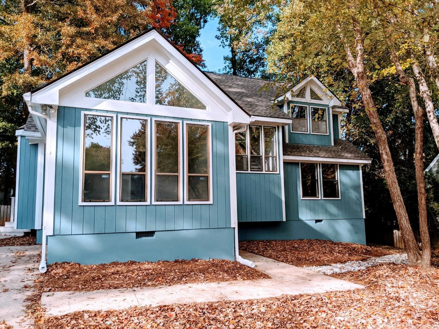Freshly Painted Exterior with oversized windows brings natural light throughout this gorgeous home Front Exterior