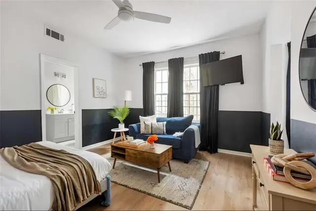 a bedroom with bed and window