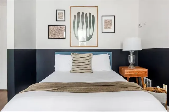 a bathroom with a sink mirror vanity and toilet