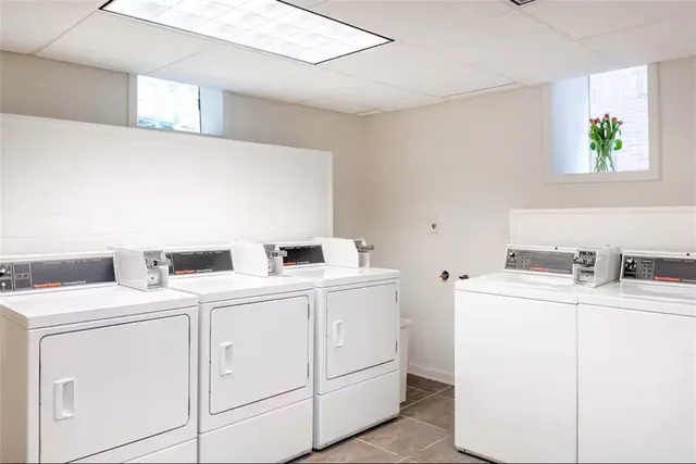 a couple of cars parked in front of a house