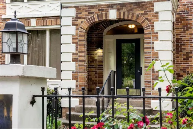 a front view of a house with glass windows