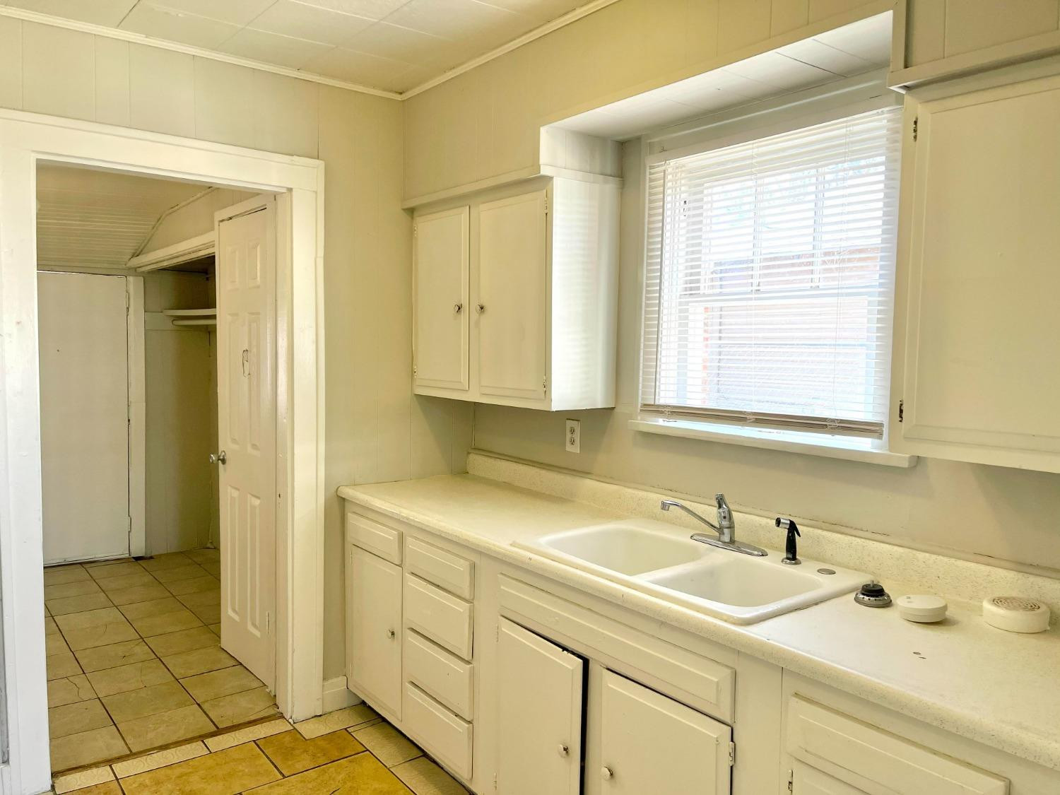 2117 15th Street, Unit A Lubbock, TX 79401 - Photo 3 of 11 a bathroom with a sink and a shower