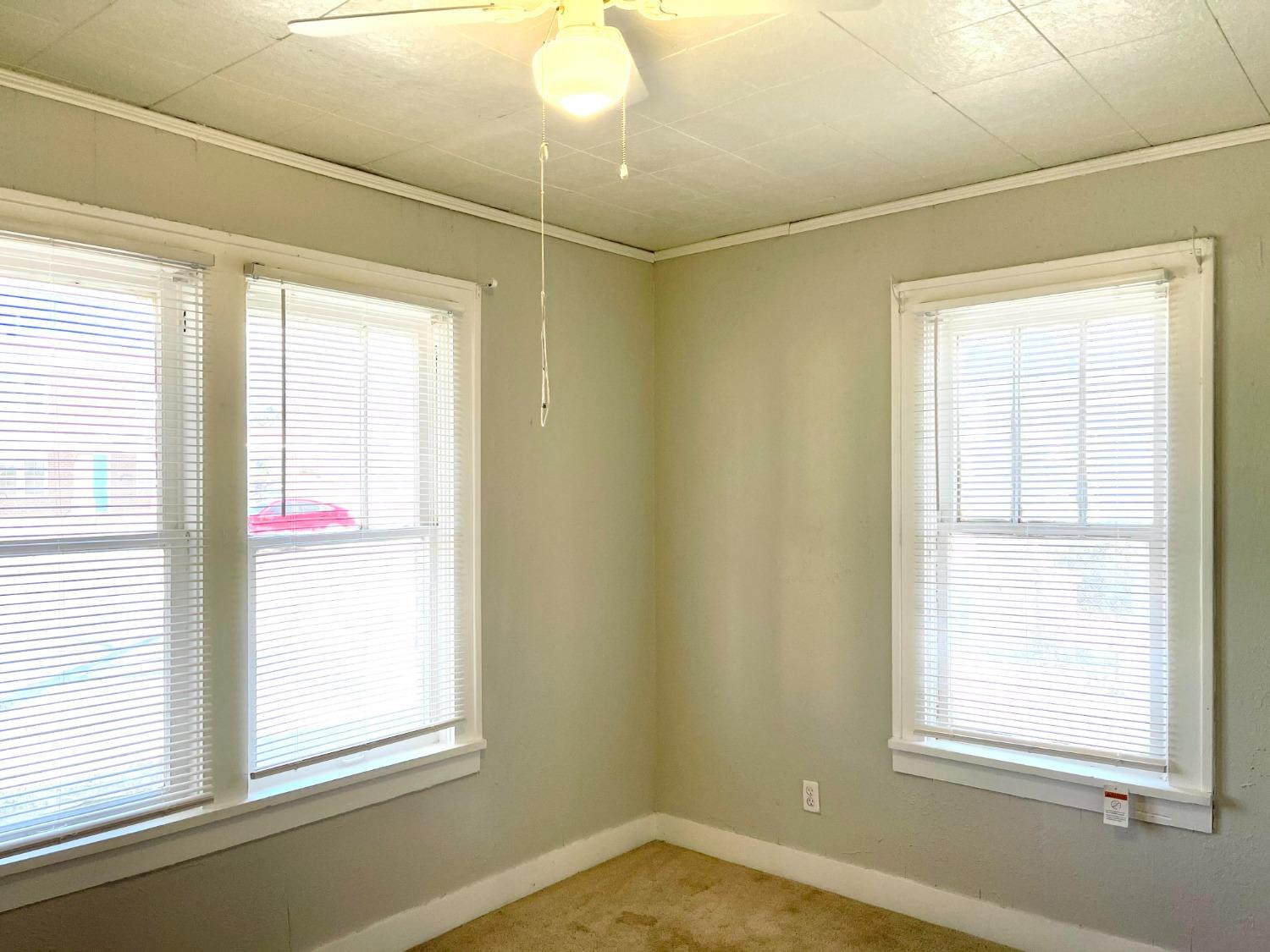 2117 15th Street, Unit A Lubbock, TX 79401 - Photo 8 of 11 a view of a room that has a window in it
