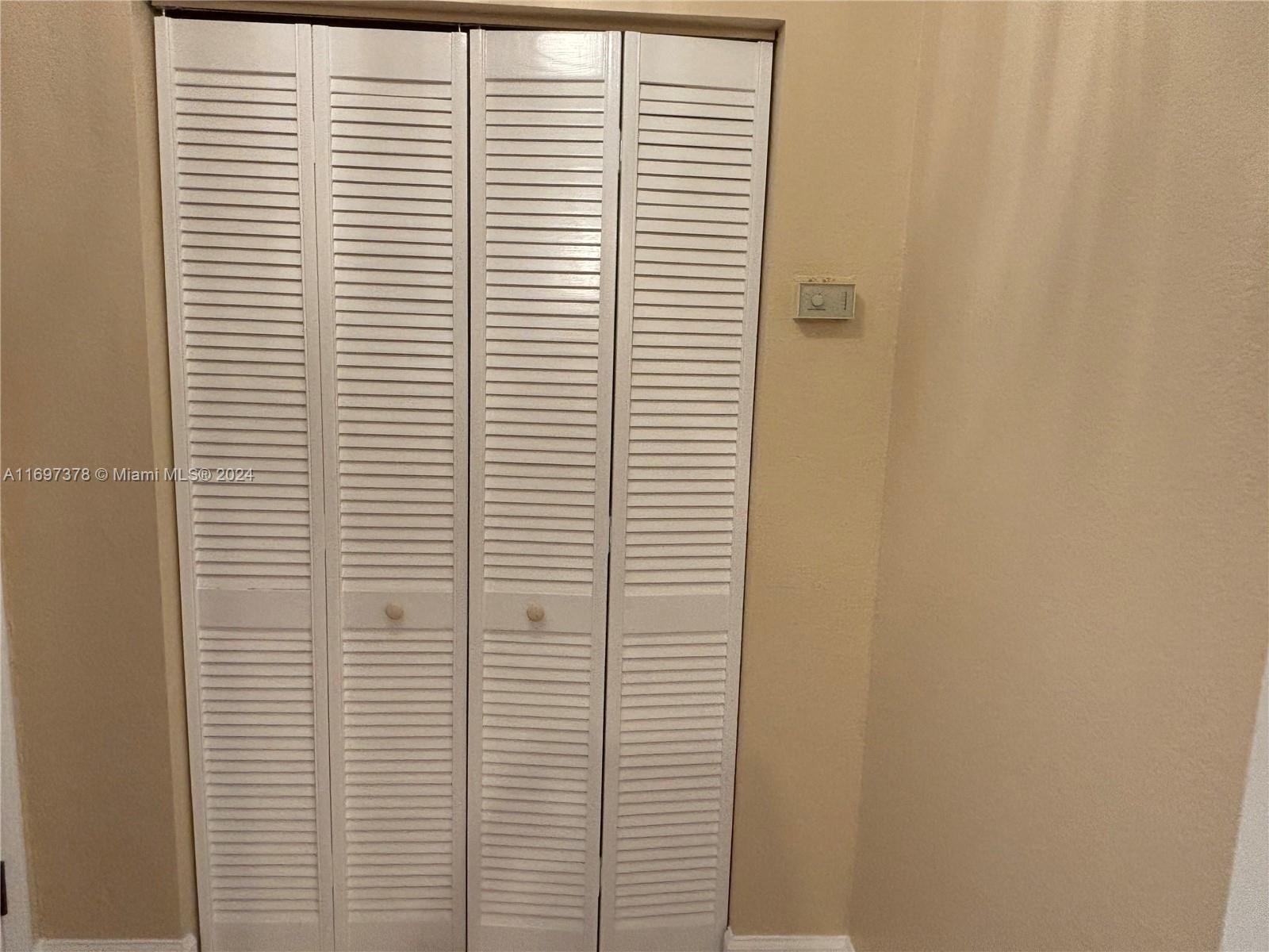3181 Southwest 13th Street, Unit 111 Miami, FL 33145 - Photo 17 of 25 Pantry/utility closet by the entrance.