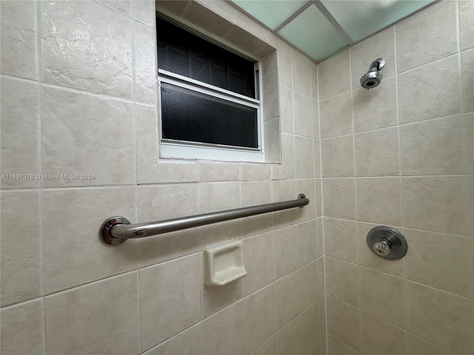 3181 Southwest 13th Street, Unit 111 Miami, FL 33145 - Photo 23 of 25 Inside the shower