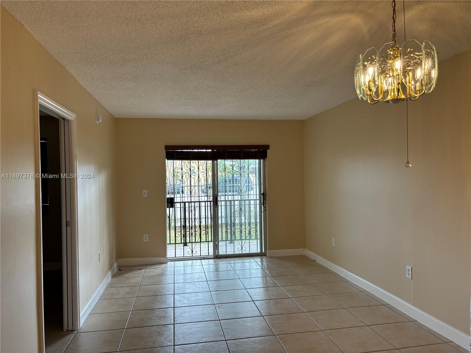 3181 Southwest 13th Street, Unit 111 Miami, FL 33145 - Photo 24 of 25 The balcony from the living room.