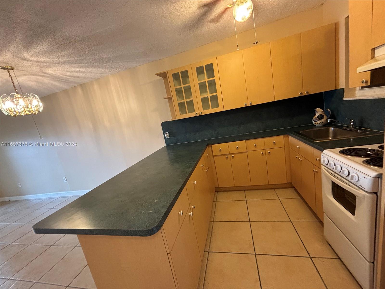 3181 Southwest 13th Street, Unit 111 Miami, FL 33145 - Photo 10 of 25 Kitchen cabinets galore for your convenience.