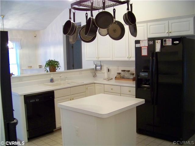 5301 Houndmaster Road Midlothian, VA 23112 - Photo 5 of 12 a kitchen with a sink dishwasher and a stove with wooden floor