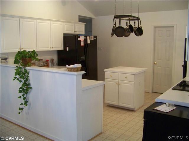 5301 Houndmaster Road Midlothian, VA 23112 - Photo 6 of 12 a kitchen with a refrigerator and a stove