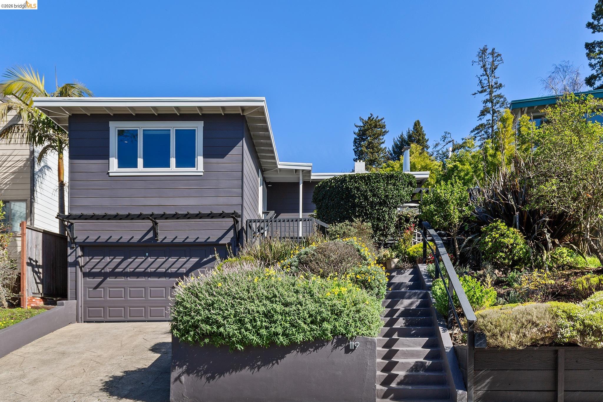 1119 Miller Avenue Berkeley, CA 94708 - Photo 1 of 33 a front view of a house with a yard