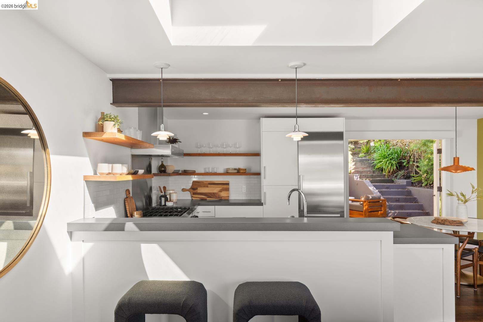 1119 Miller Avenue Berkeley, CA 94708 - Photo 12 of 33 a kitchen with stainless steel appliances a sink and a refrigerator