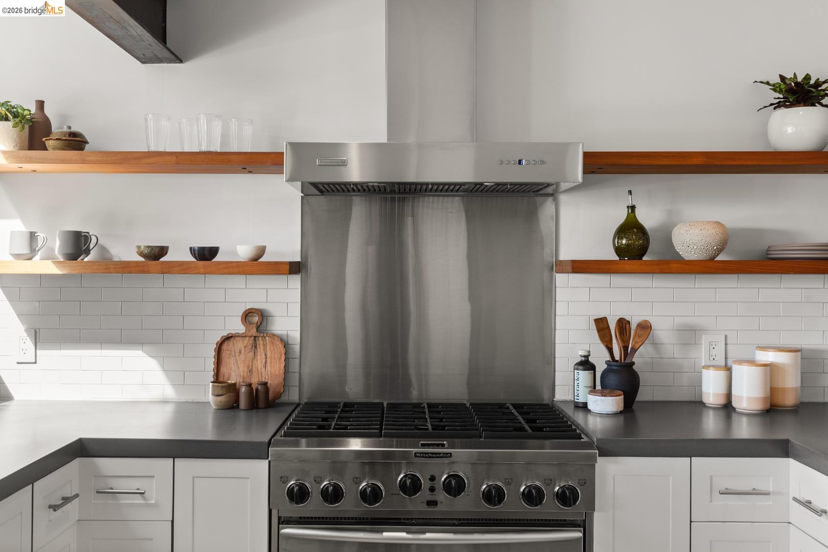 1119 Miller Avenue Berkeley, CA 94708 - Photo 15 of 33 a kitchen with white cabinets and a stove