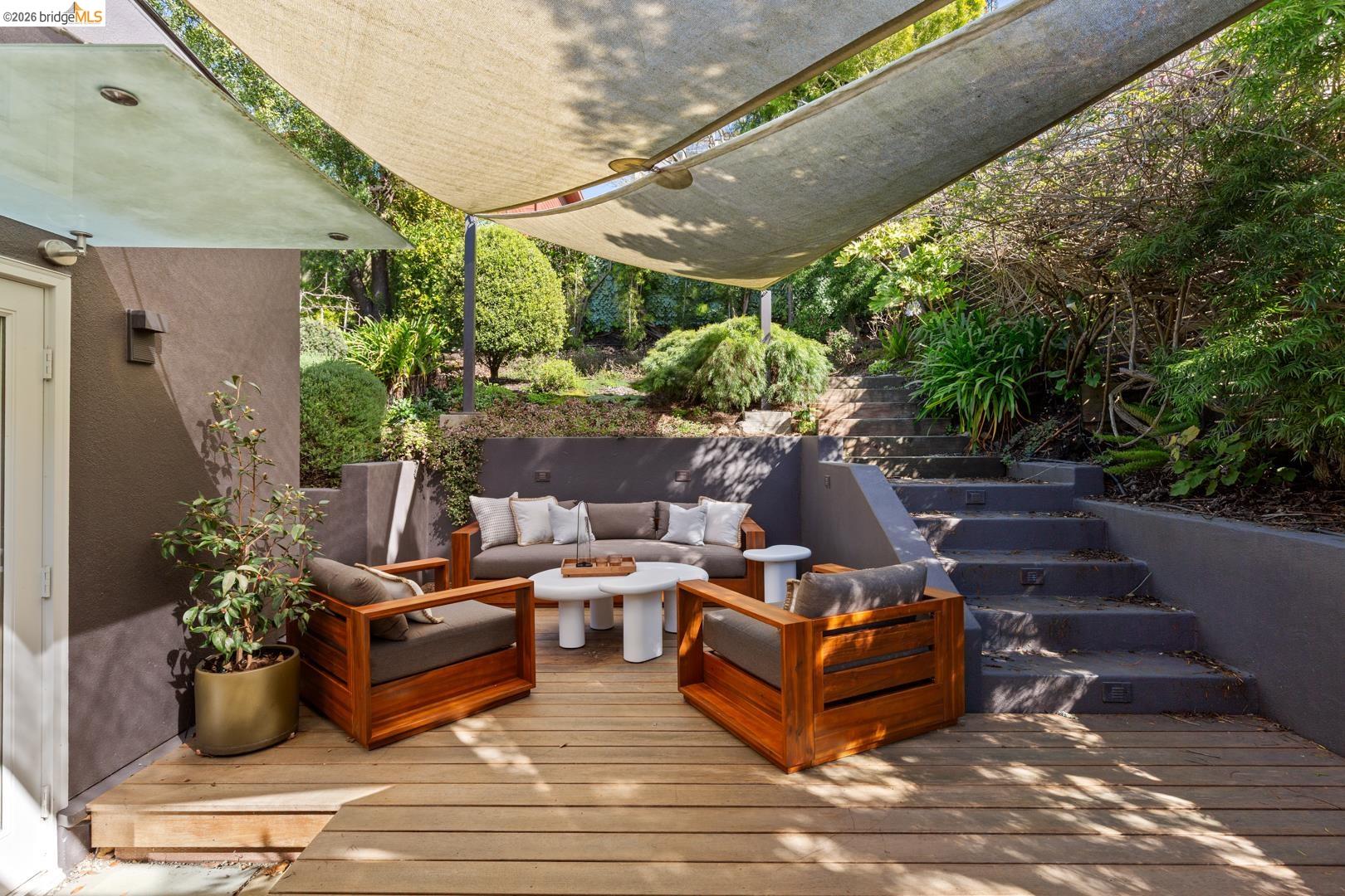 1119 Miller Avenue Berkeley, CA 94708 - Photo 28 of 33 a view of a patio with couches table and chairs and potted plants