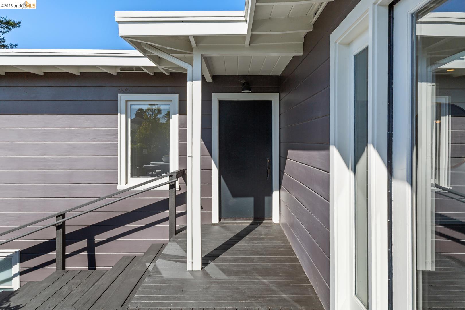 1119 Miller Avenue Berkeley, CA 94708 - Photo 3 of 33 a view of a porch with wooden floor and stairs
