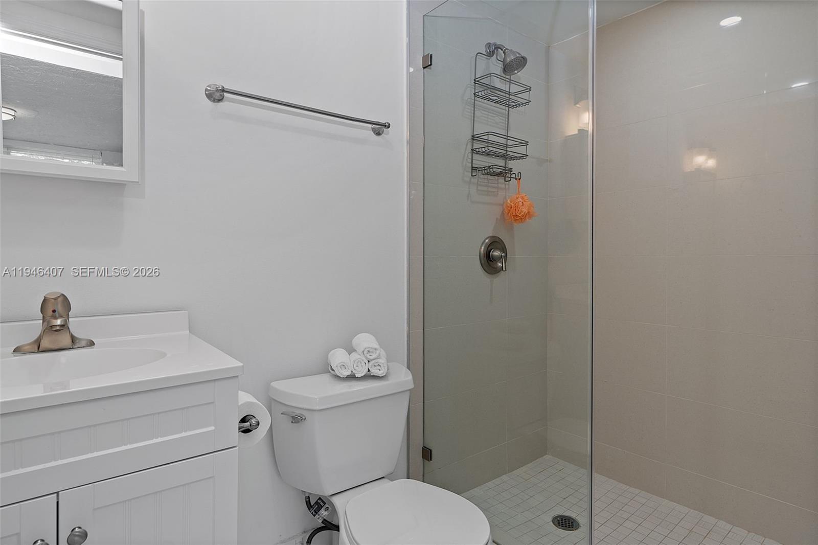 5845 Southwest 88th Street Miami, FL 33156 - Photo 13 of 25 a bathroom with a shower a toilet and sink