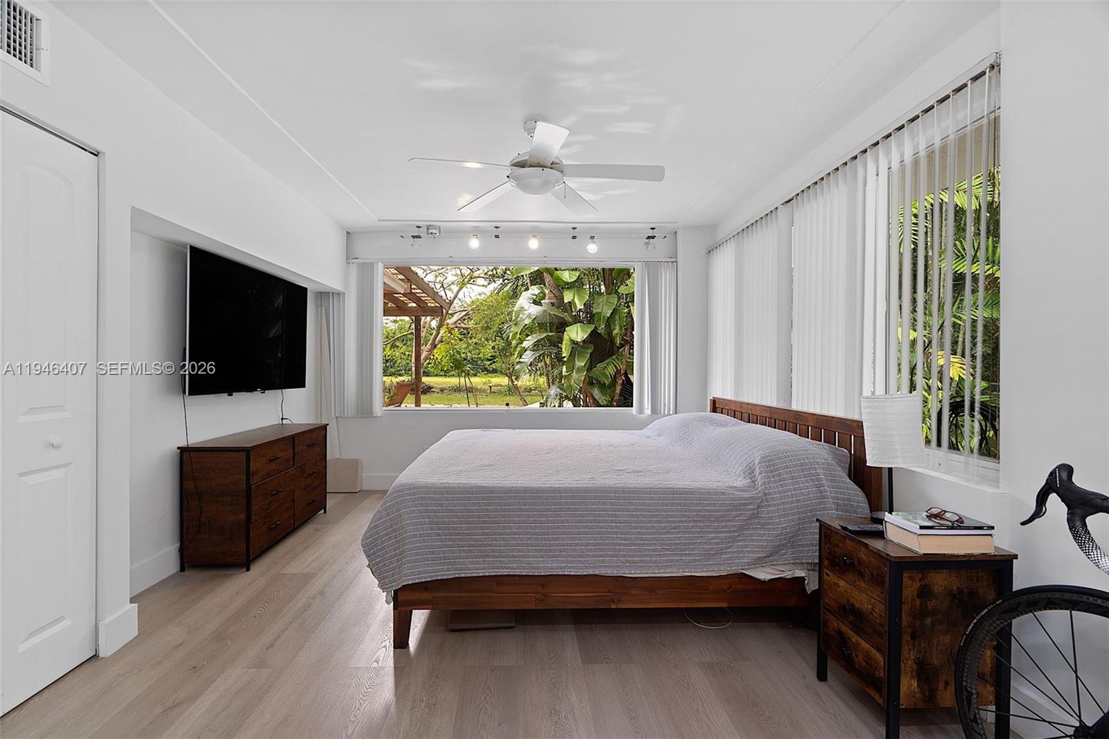 5845 Southwest 88th Street Miami, FL 33156 - Photo 14 of 25 a bed room with a bed and a television