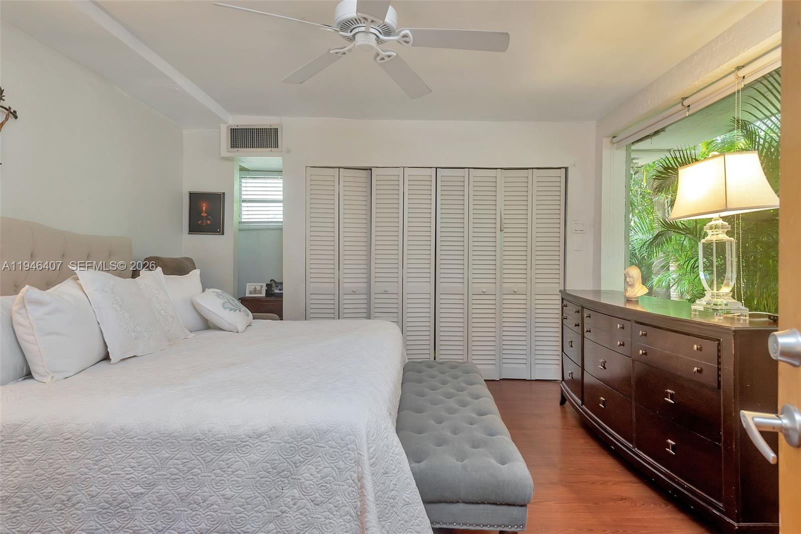 5845 Southwest 88th Street Miami, FL 33156 - Photo 19 of 25 a bedroom with a large bed and a couch