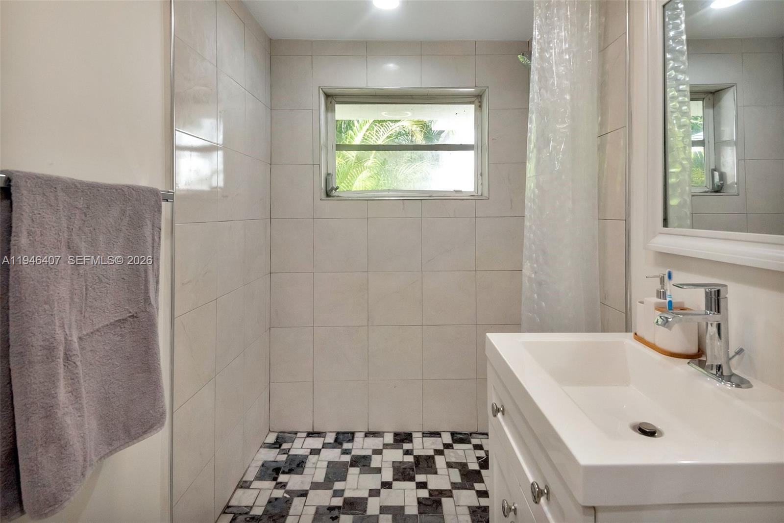5845 Southwest 88th Street Miami, FL 33156 - Photo 22 of 25 a bathroom with a sink and a shower