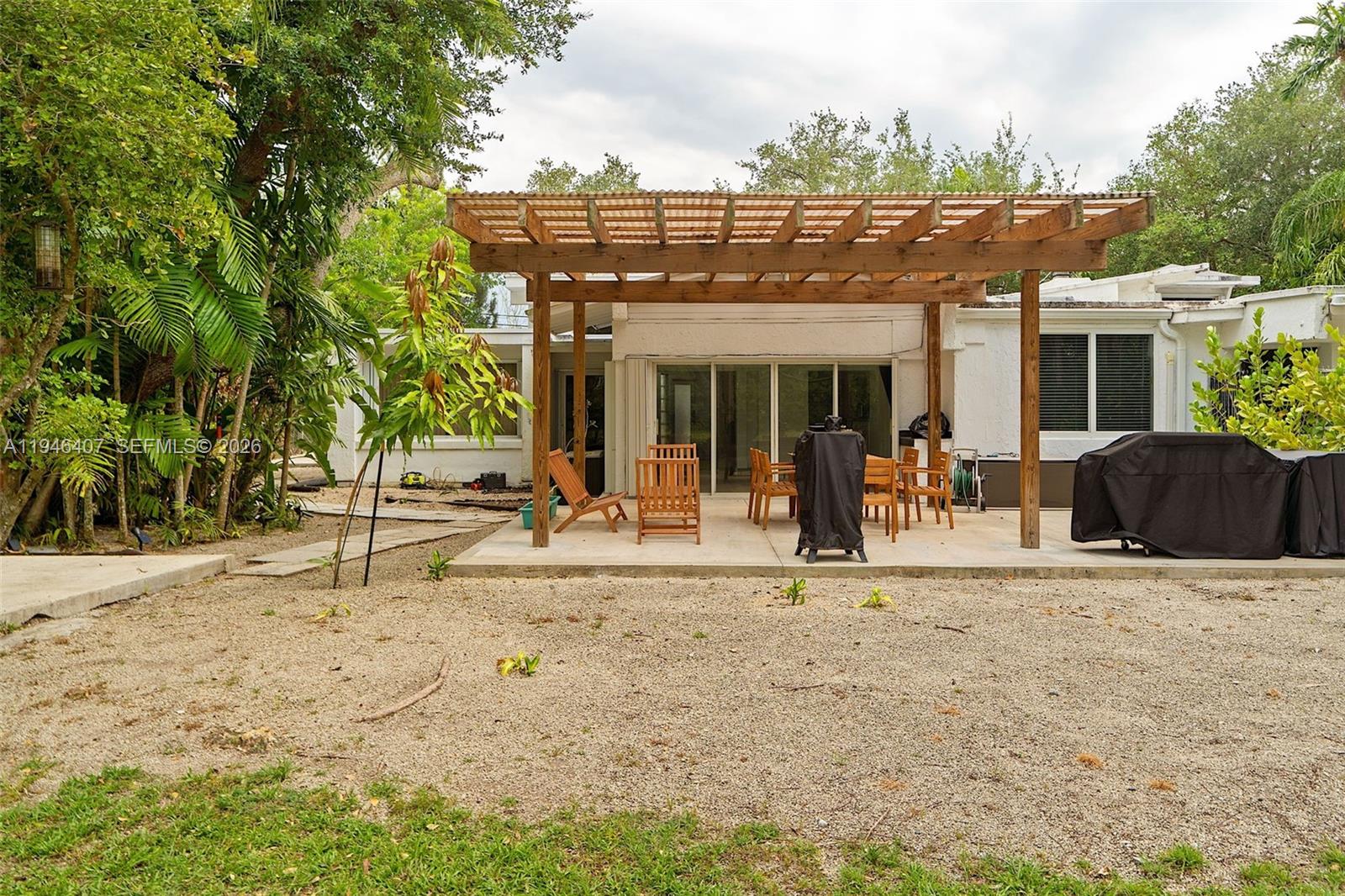 5845 Southwest 88th Street Miami, FL 33156 - Photo 25 of 25 a view of a house with a outdoor space