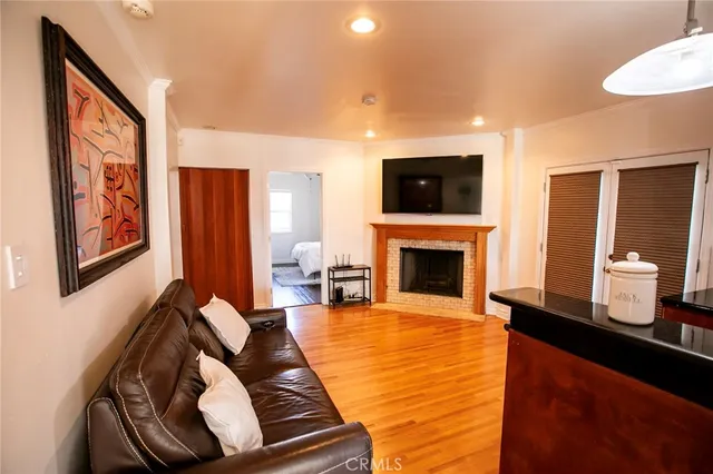 a living room with furniture fireplace and flat screen tv