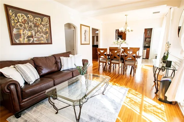 a living room with furniture and a table