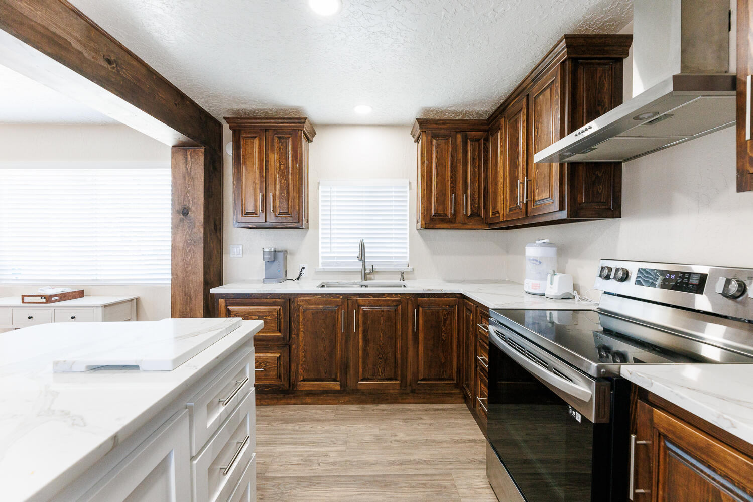 3807 East 3rd Street Lubbock, TX 79403 - Photo 15 of 35 a kitchen with a sink stove and cabinets
