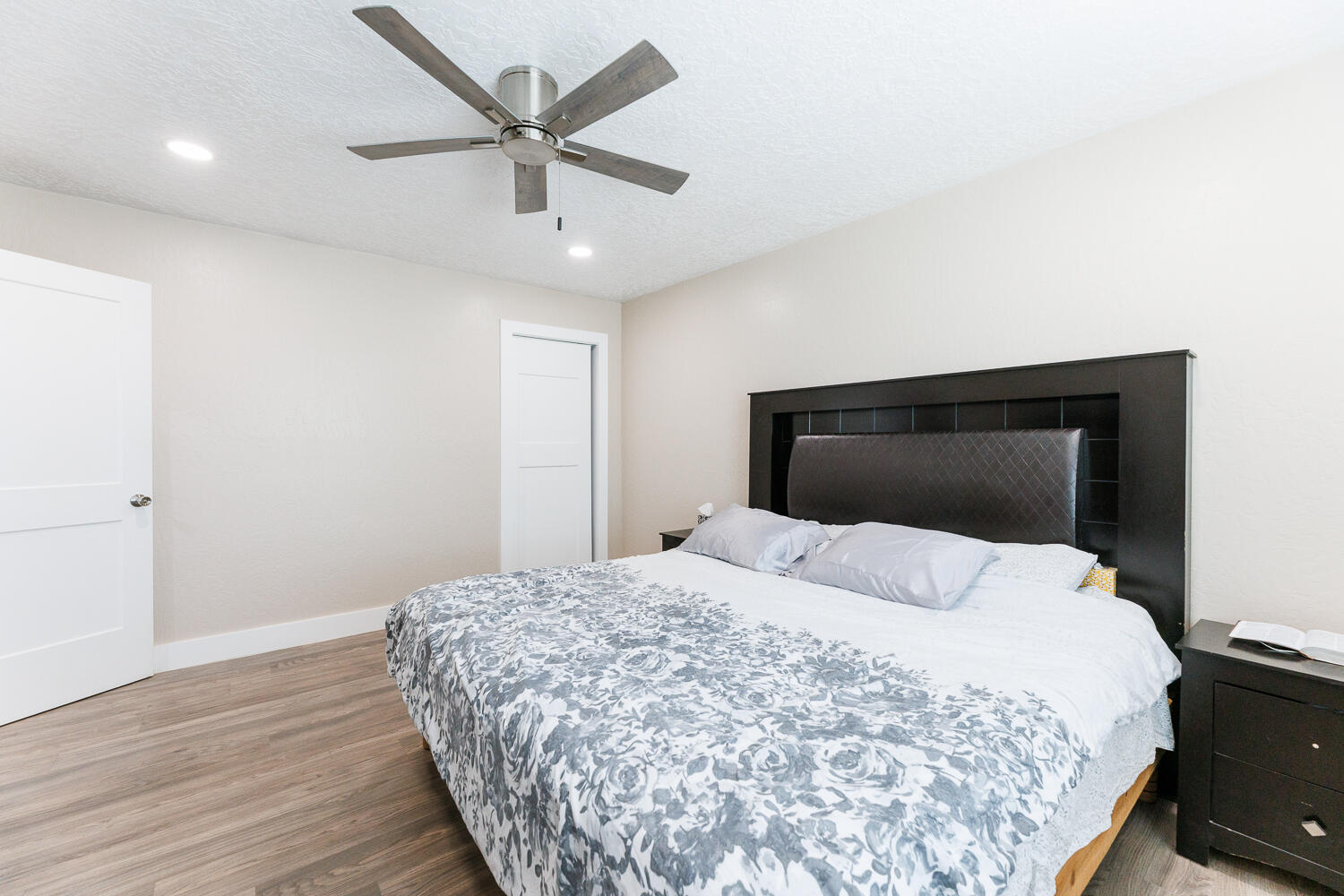 3807 East 3rd Street Lubbock, TX 79403 - Photo 21 of 35 a bedroom with a bed and a ceiling fan