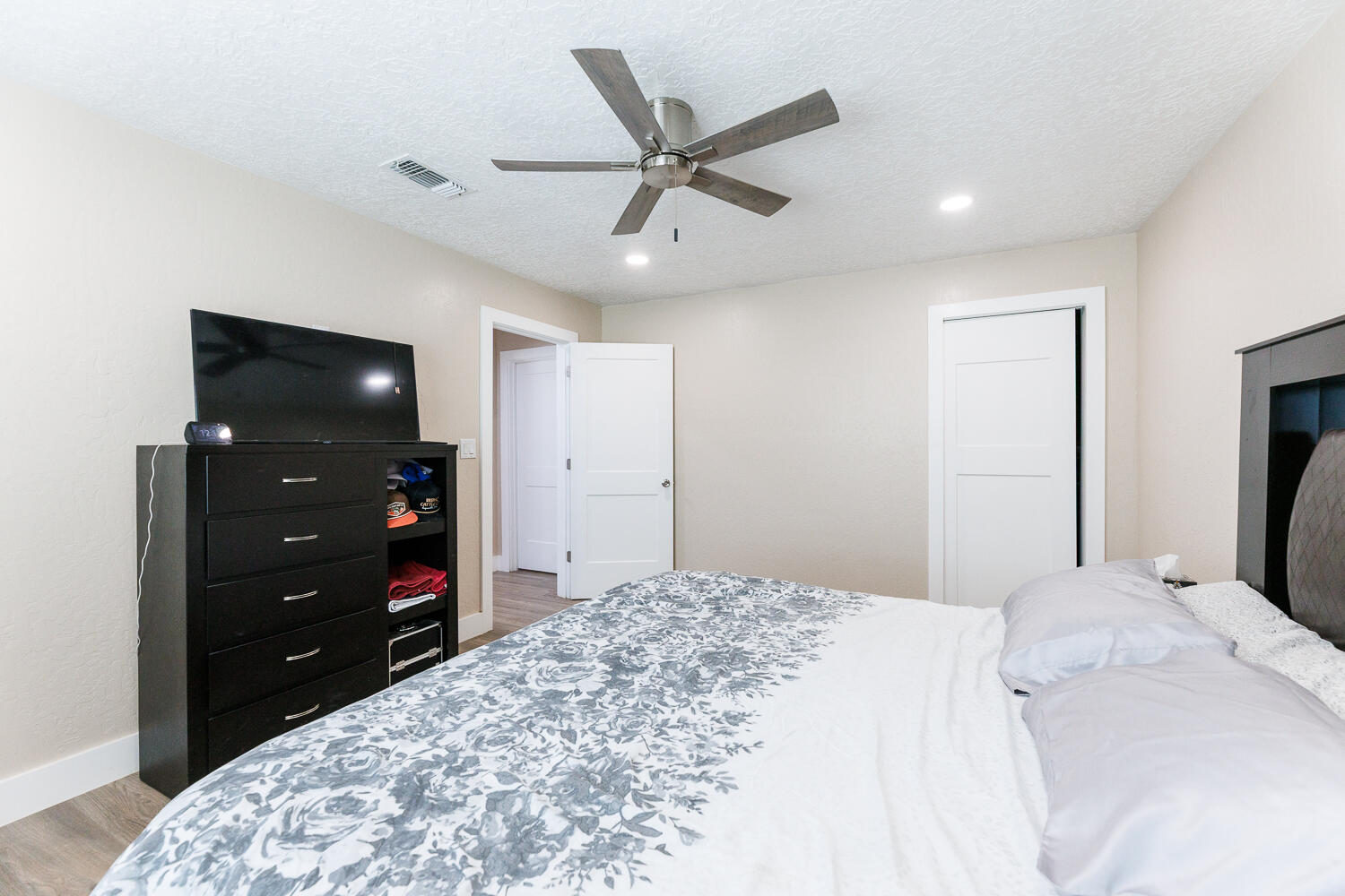 3807 East 3rd Street Lubbock, TX 79403 - Photo 22 of 35 a bedroom with a bed and a tv