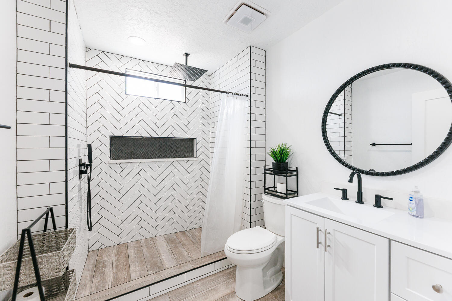 3807 East 3rd Street Lubbock, TX 79403 - Photo 24 of 35 a bathroom with a sink a mirror a toilet and vanity