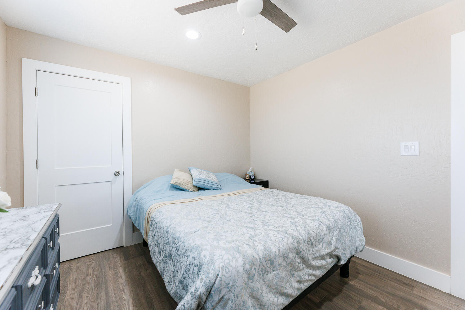3807 East 3rd Street Lubbock, TX 79403 - Photo 28 of 35 a bedroom with a bed and wooden floor