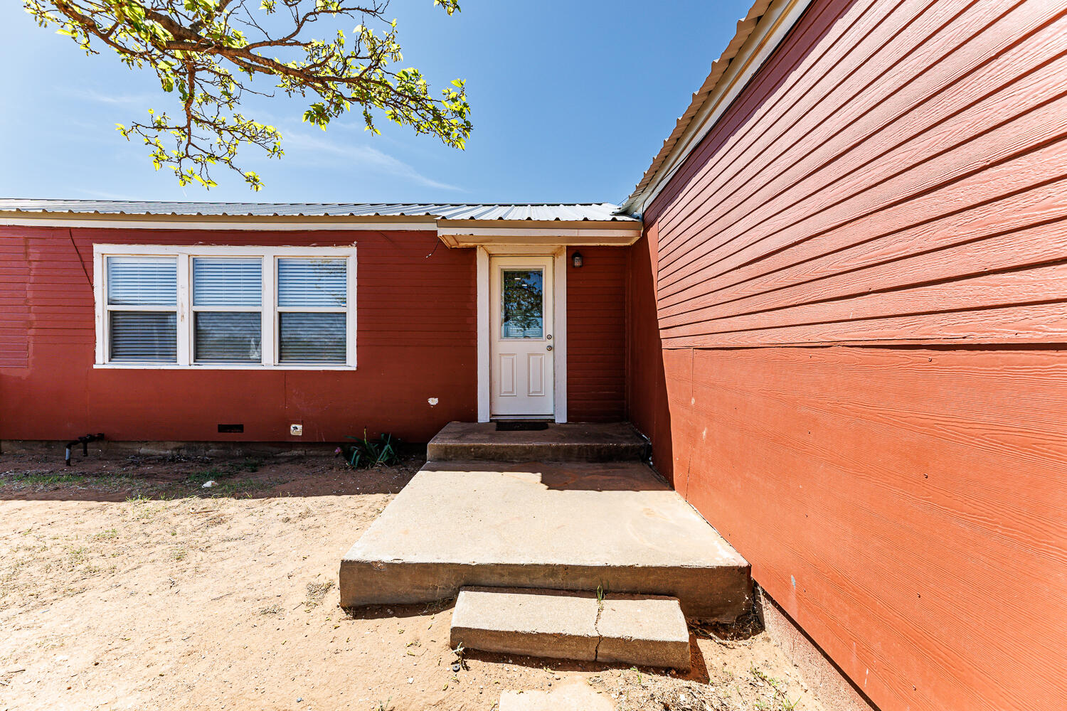 3807 East 3rd Street Lubbock, TX 79403 - Photo 33 of 35 a front view of a house with a yard