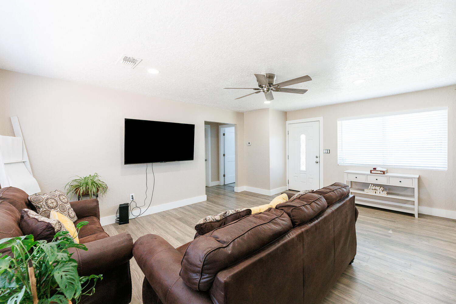 3807 East 3rd Street Lubbock, TX 79403 - Photo 5 of 35 a living room with furniture and a flat screen tv