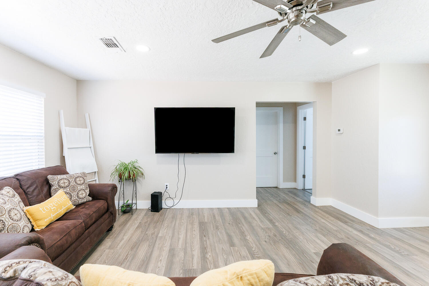 3807 East 3rd Street Lubbock, TX 79403 - Photo 6 of 35 a living room with furniture and a flat screen tv
