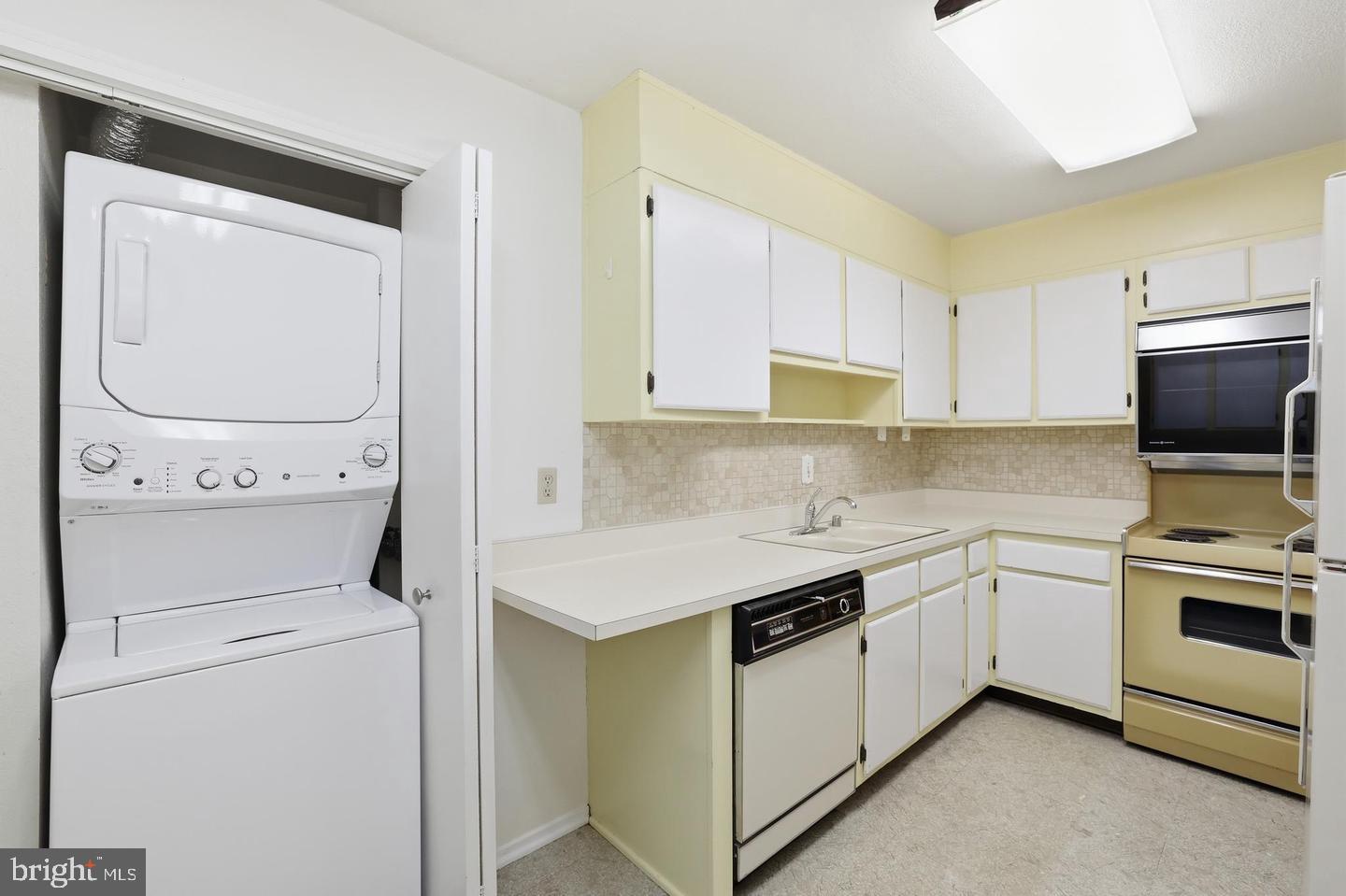 6101 Edsall Road, Unit 502 Alexandria, VA 22304 - Photo 11 of 34 In-unit laundry with new washer-dryer