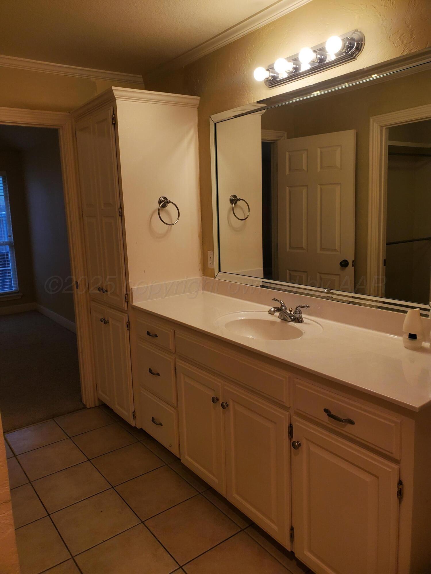 1 Windtree Amarillo, TX 79109 - Photo 7 of 18 a spacious bathroom with a double vanity sink a mirror and a shower