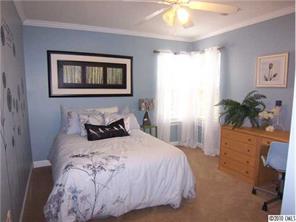944 Knightsbridge Road Fort Mill, SC 29708 - Photo 13 of 16 a bedroom with a bed and a potted plant