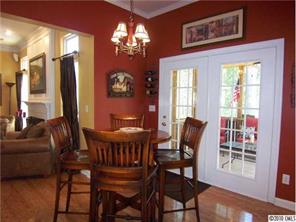 944 Knightsbridge Road Fort Mill, SC 29708 - Photo 6 of 16 a view of a dining room with furniture a chandelier and wooden floor